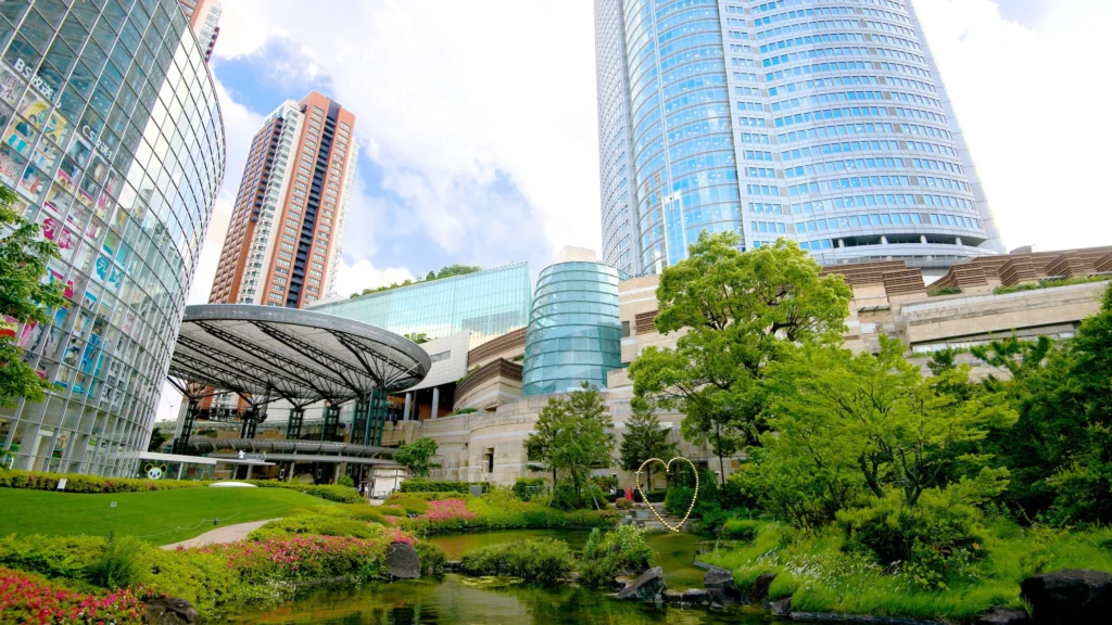 Modern central Tokyo skyline with high-rise buildings and city lights.