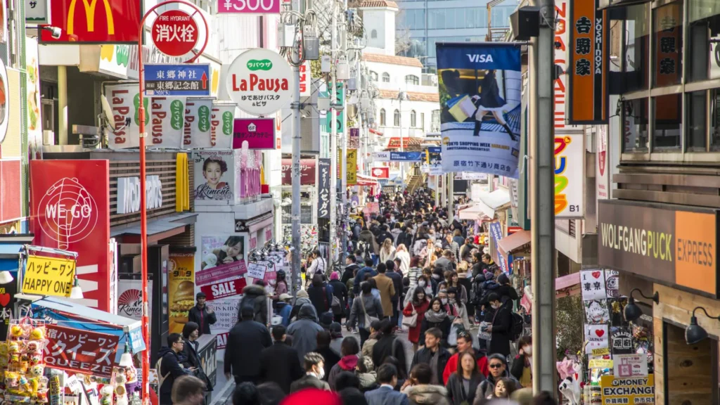 Bustling Akihabara shopping streets in Tokyo with electronics stores and anime billboards.